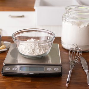 Bowl with flour on a small scale