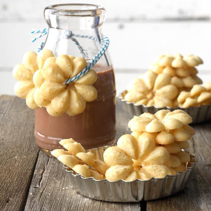 Cardamom Spritz cookies served in a cookie tin