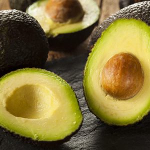 Organic Raw Green Avocados Sliced in Half