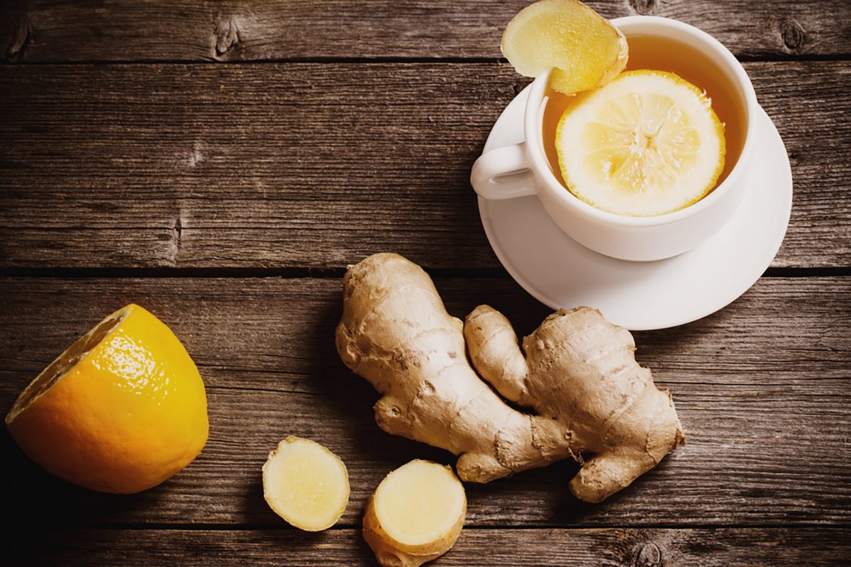 Ginger tea with lemon in a white cup