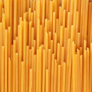 Uncooked spaghetti noodle abstract; 