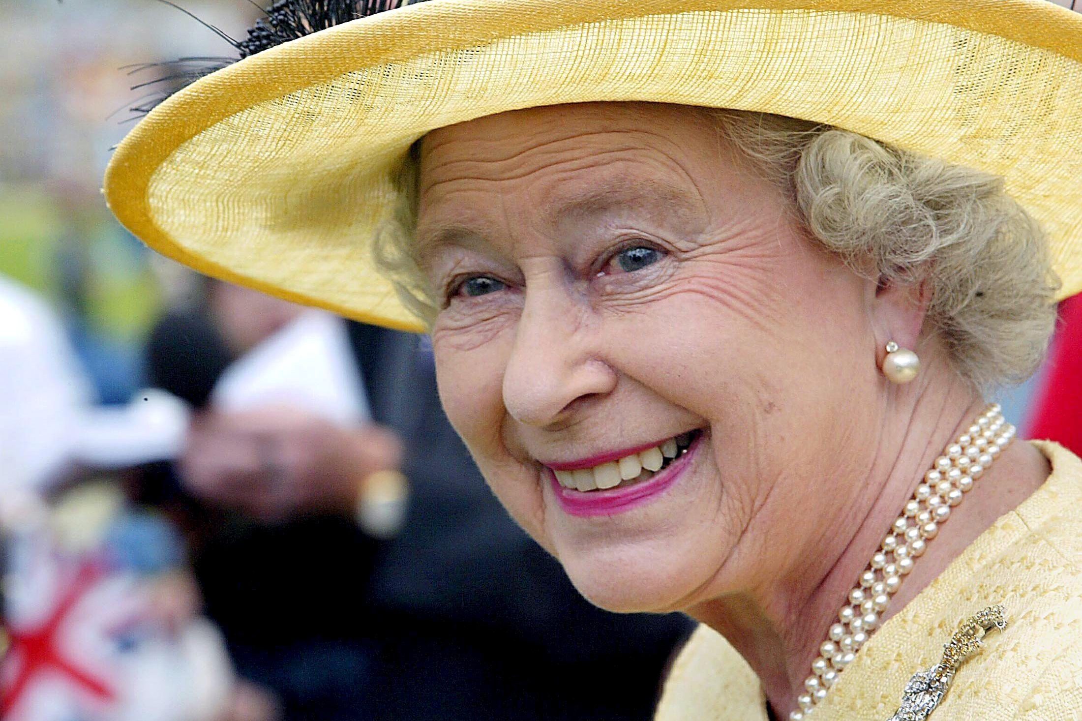 QUEEN ELIZABETH II QUEEN ELIZABETH II HOSTING A TEA PARTY FOR DISADVANTAGED CHILDREN, BUCKINGHAM PALACE, LONDON, BRITAIN - 02 JUN 2003