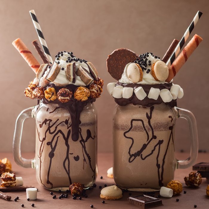 Chocolate milkshake with ice cream and with whipped cream, marshmallow, sweet popcorn, cookies, waffles, served in glass mason jar. "Freak or crazy" sweet shake.; Shutterstock ID 667618195; Job (TFH, TOH, RD, BNB, CWM, CM): Taste of Home