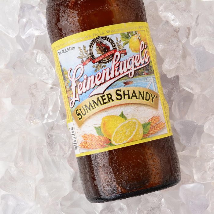 A bottle of Leinenkugel Summer Shandy on a bed of ice.