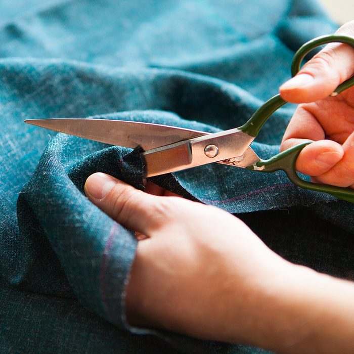 Tailor. Man Hands notch tailor tailor's scissors cloth. Close Up.; Shutterstock ID 624499169; Job (TFH, TOH, RD, BNB, CWM, CM): TOH