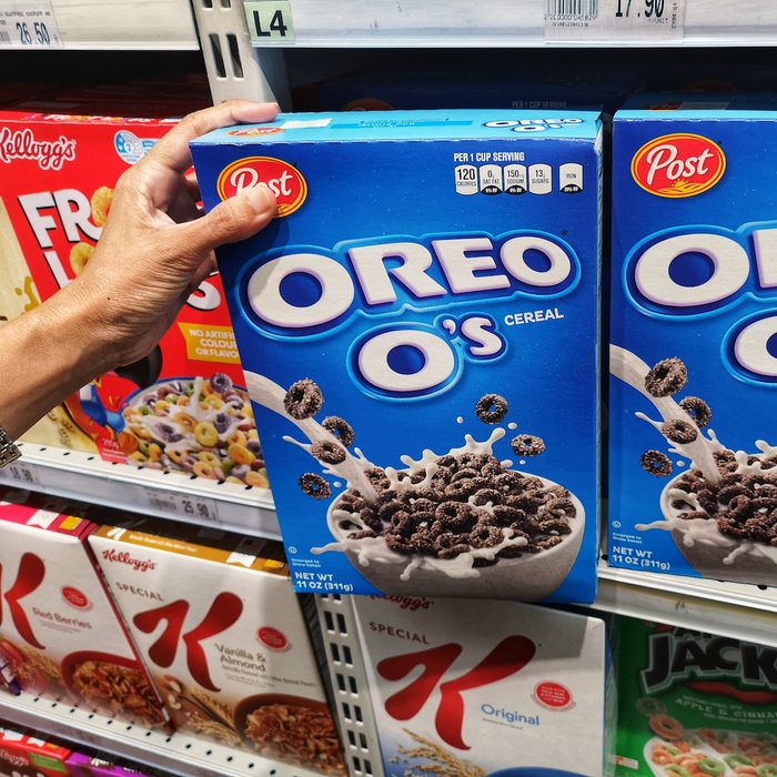buying a box of OREO O's Cereal in the supermarket aisle