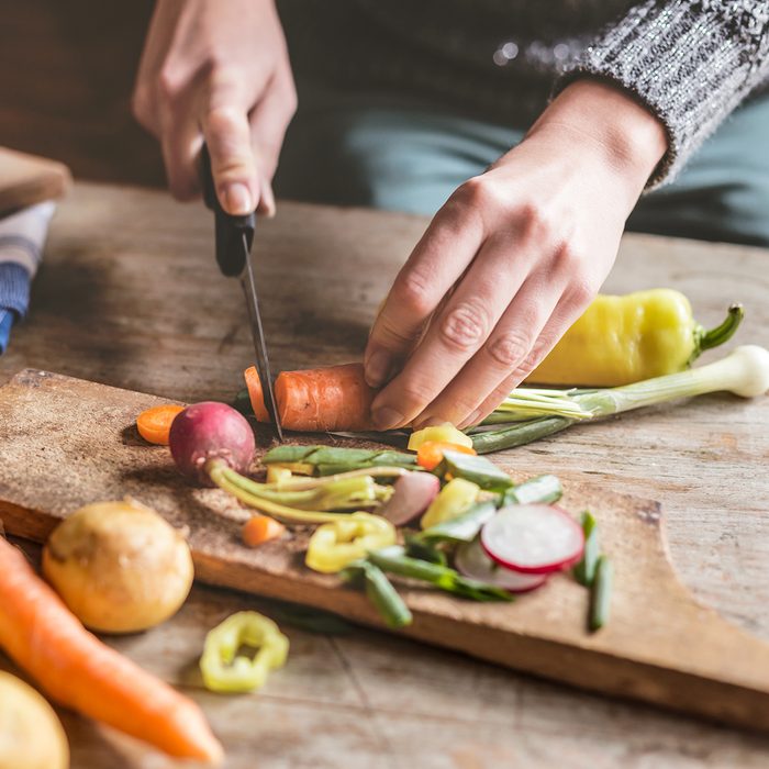 Woman Chopping food ingredients