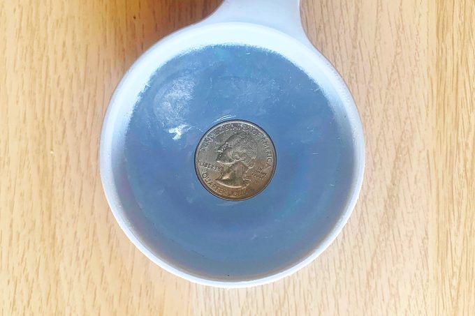 This Is Why People Leave a Quarter in a Cup of Frozen Water in the Freezer