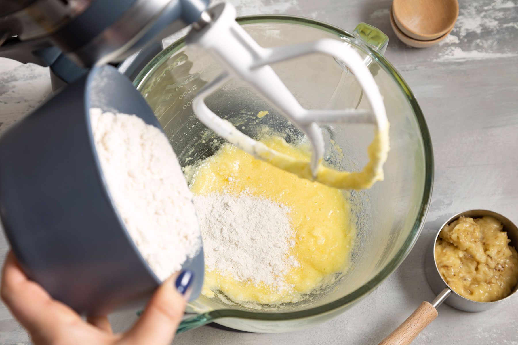 Adding flour in the egg mixture 