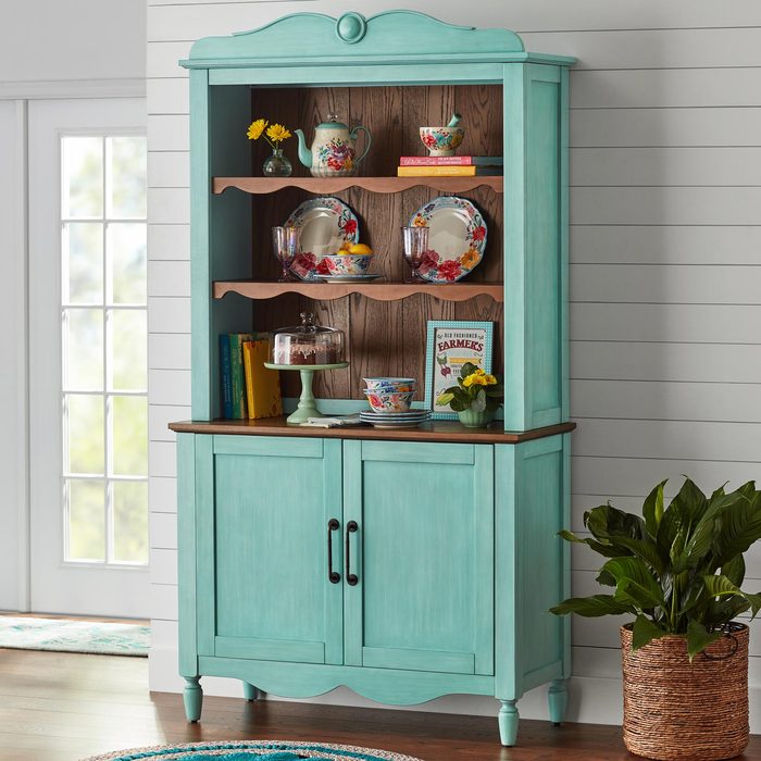 A Blue Cabinet With Plates and Cups on Shelves