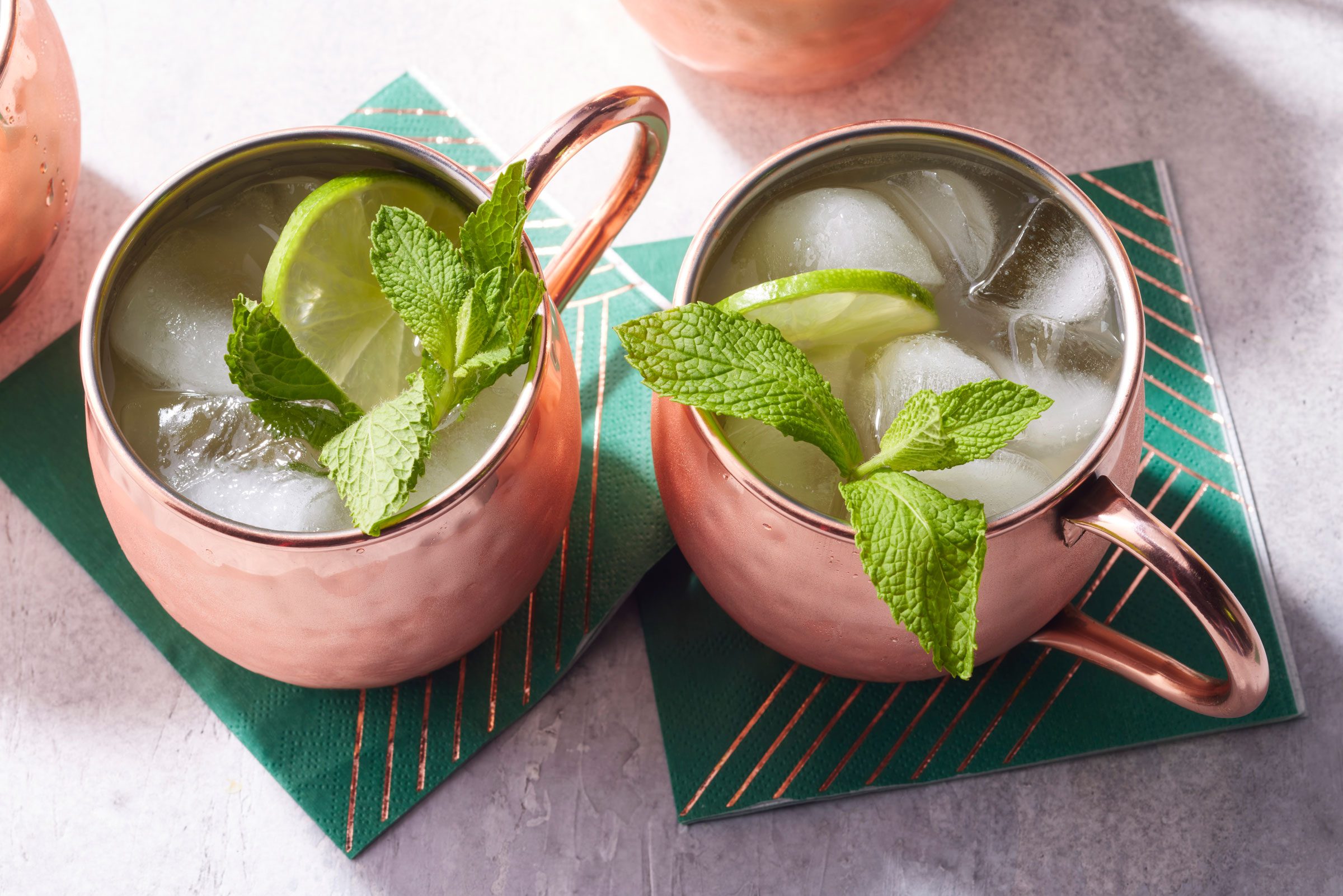 two copper mugs with Kentucky Mule
