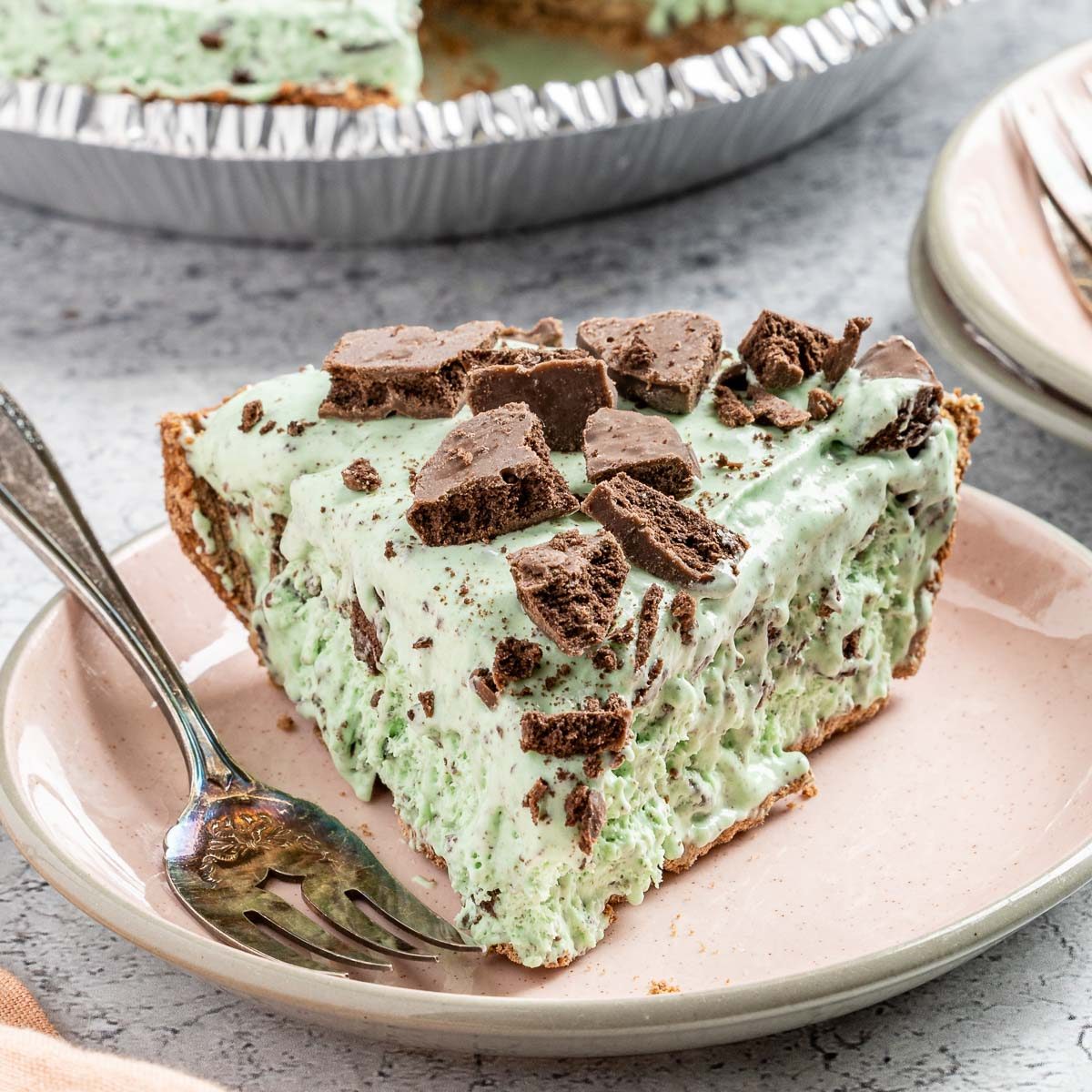 Taste of Home Grasshopper Pie photo of the finished recipe cut into slices and served on a plate.