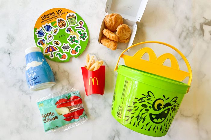 McDonald's Fast Food Kids Meal items arranged on marble kitchen counter