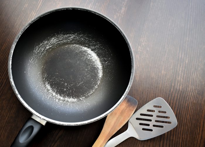 Old scratched non-stick saucepan.