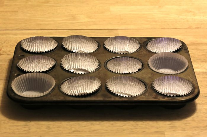 Empty baking tin for cupcakes and muffins with tinfoil liners