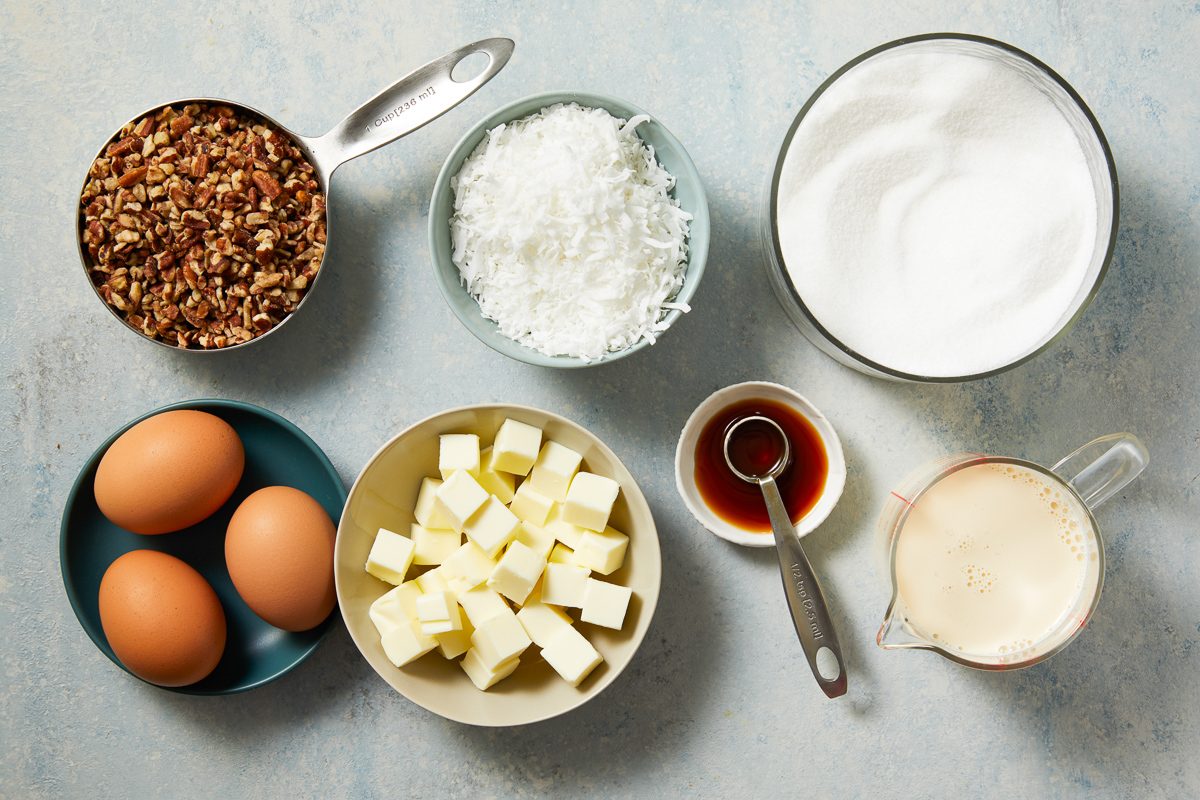 milk, sugar, eggs, butter, vanilla extract, chopped pecans and coconut flakes