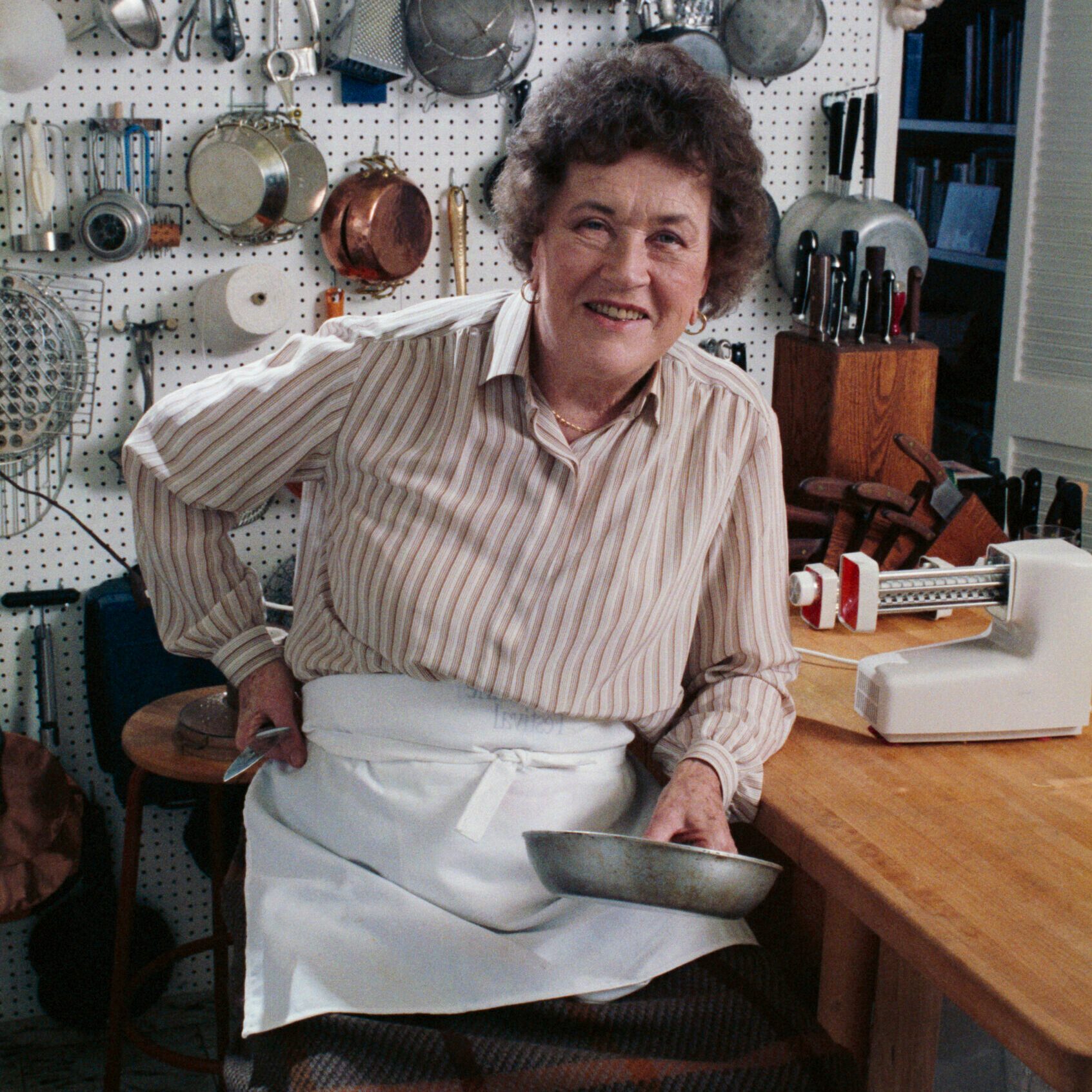 Julia Child Posing in her Kitchen