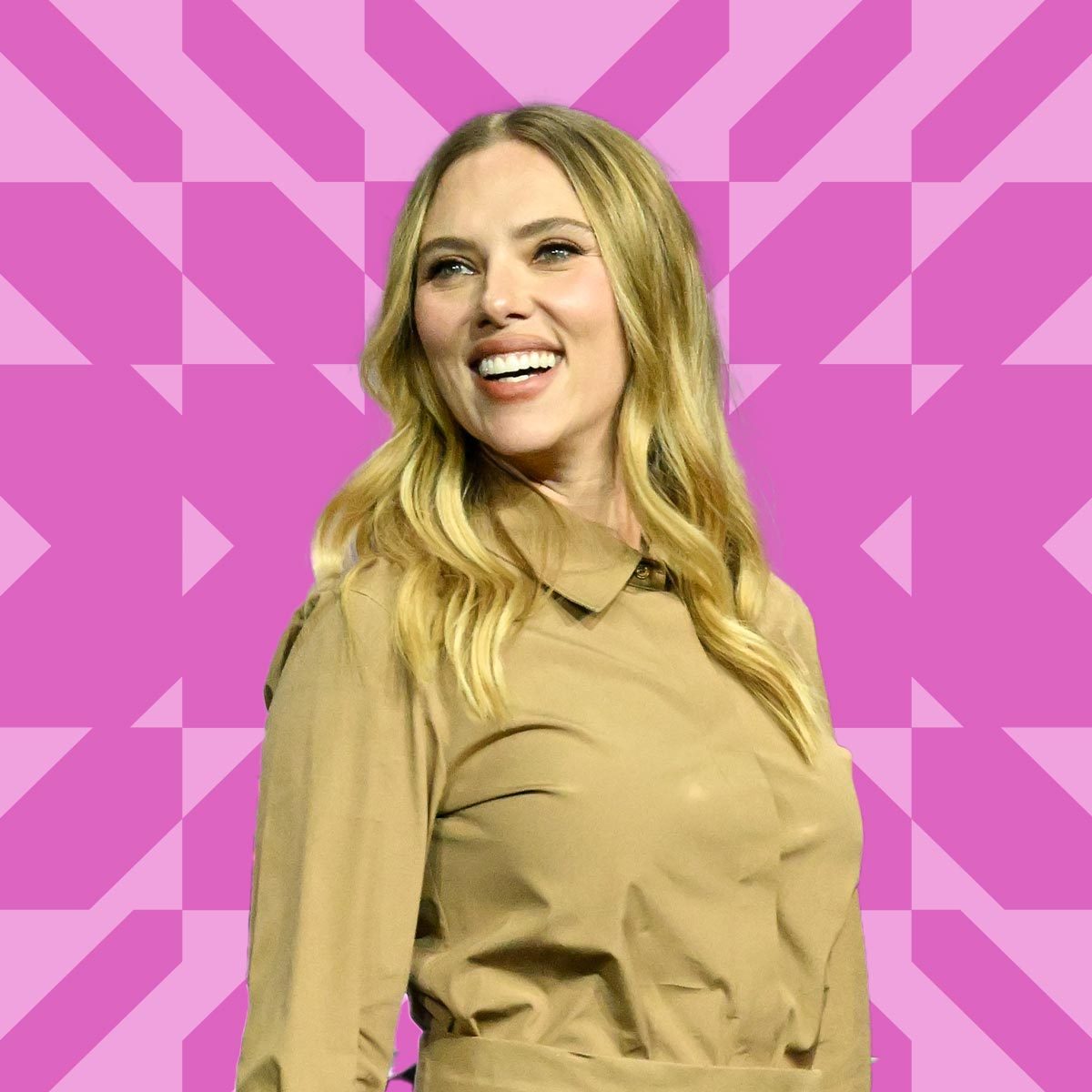 Scarlett Johansson wearing a tan dress on a pink background